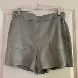 Gray satin shorts.